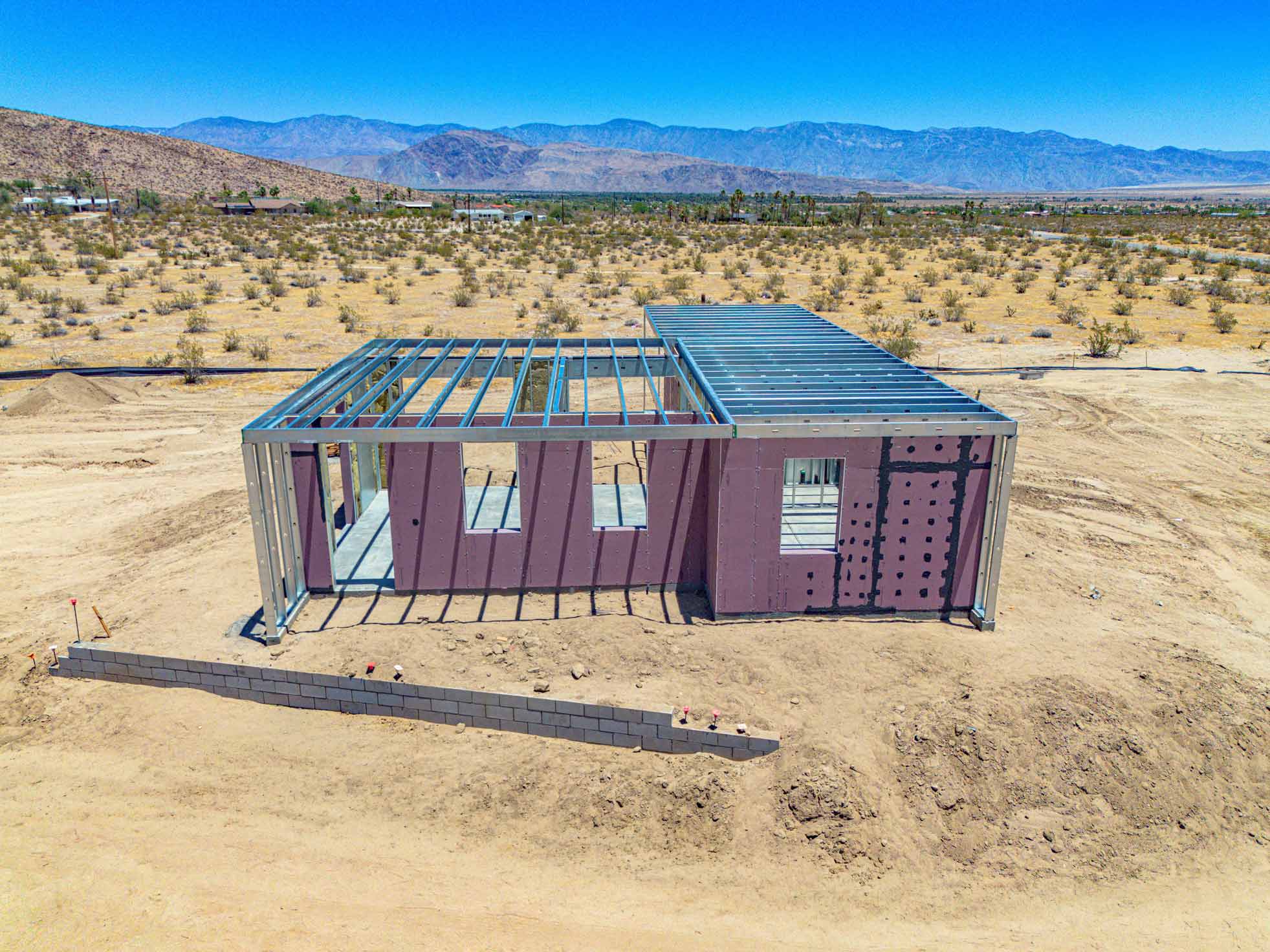 Steel-framed 4C SAFE structure standing on site at Borrego Springs, with desert mountains in the background