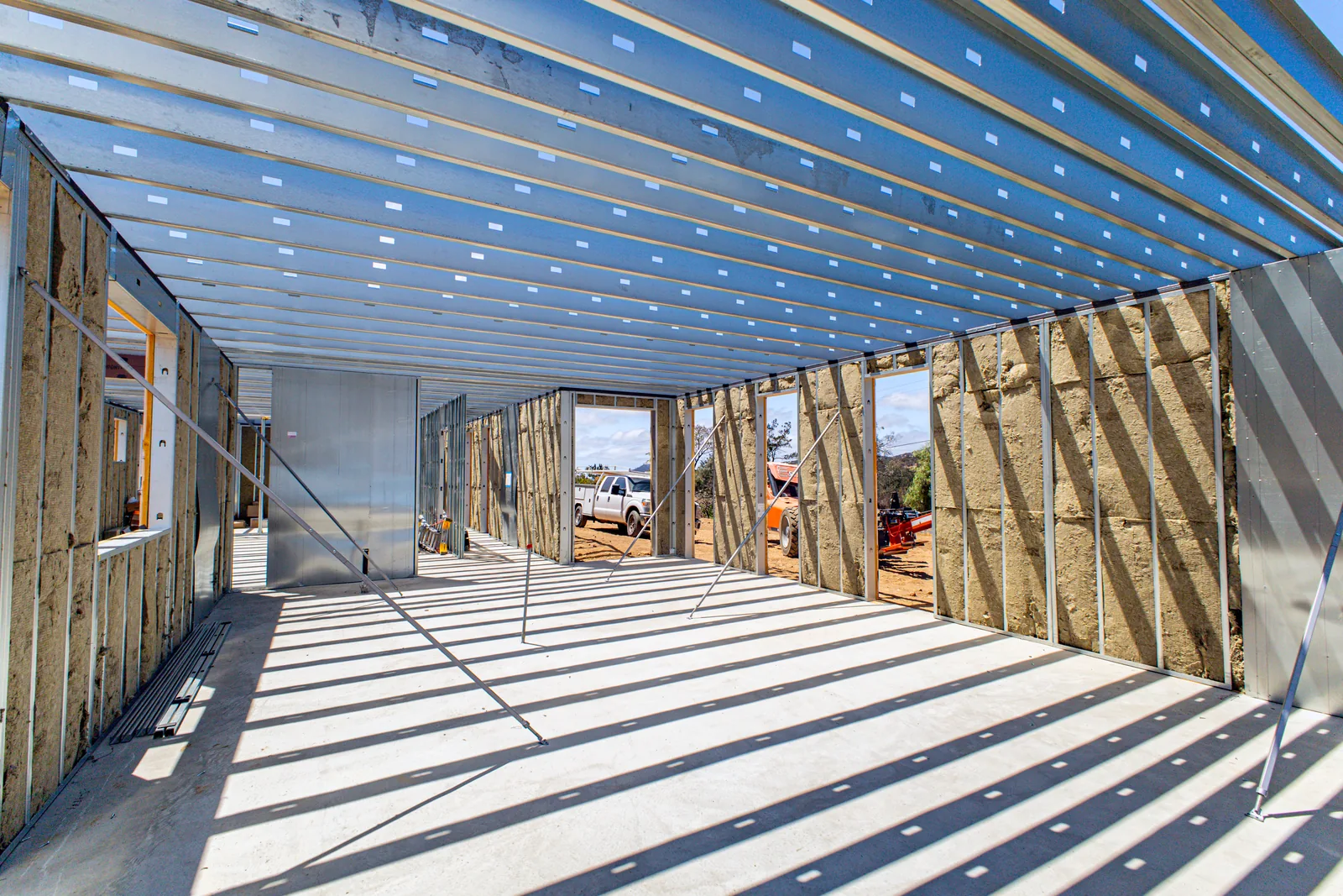 Interior view of steel-framed walls and roof structure at the Escondido Residence