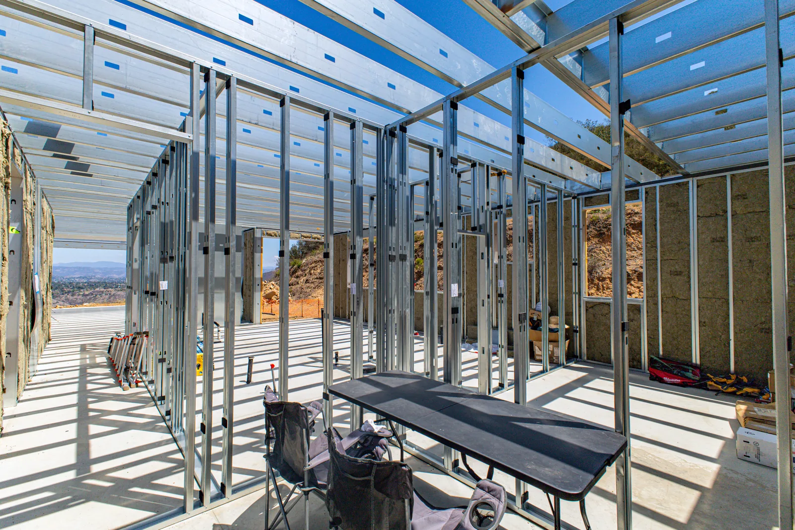 Steel roof framing and insulation installed at the Escondido Residence